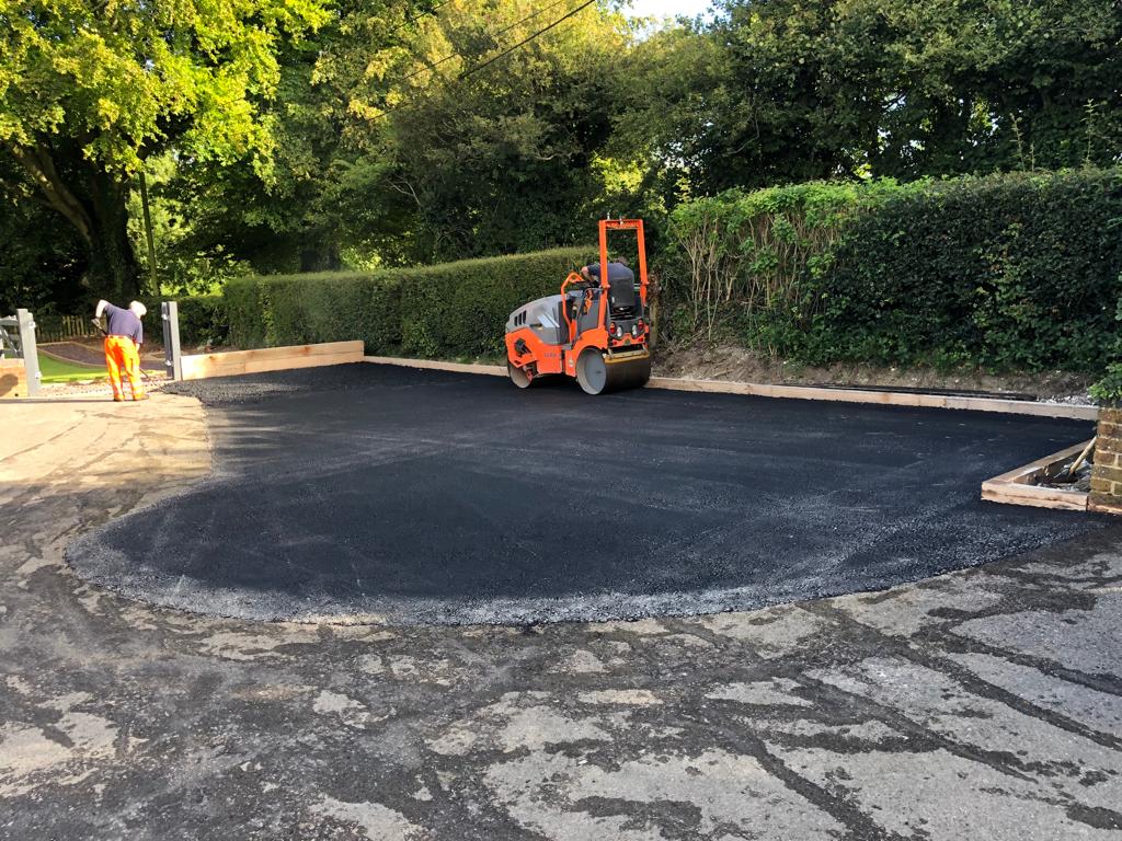 This is a photo of a bitumen driveway which is in the process of being installed by Cessnock Road Tek